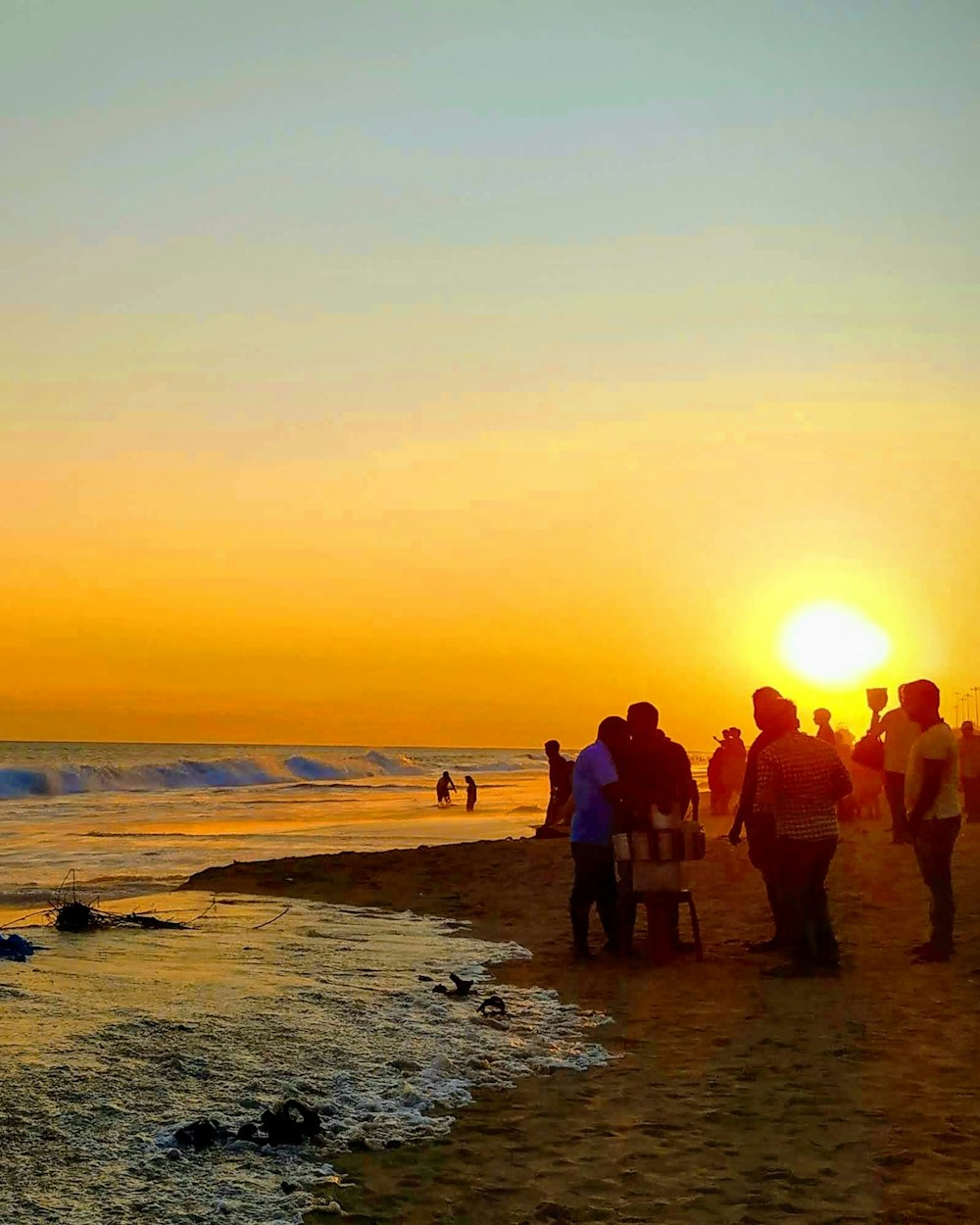 Visitors on Puri beach at sunset