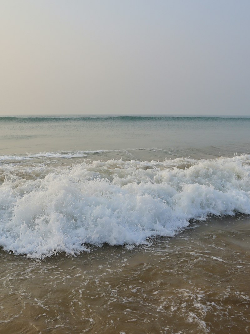 Waves rolling onto the shore at Puri beach