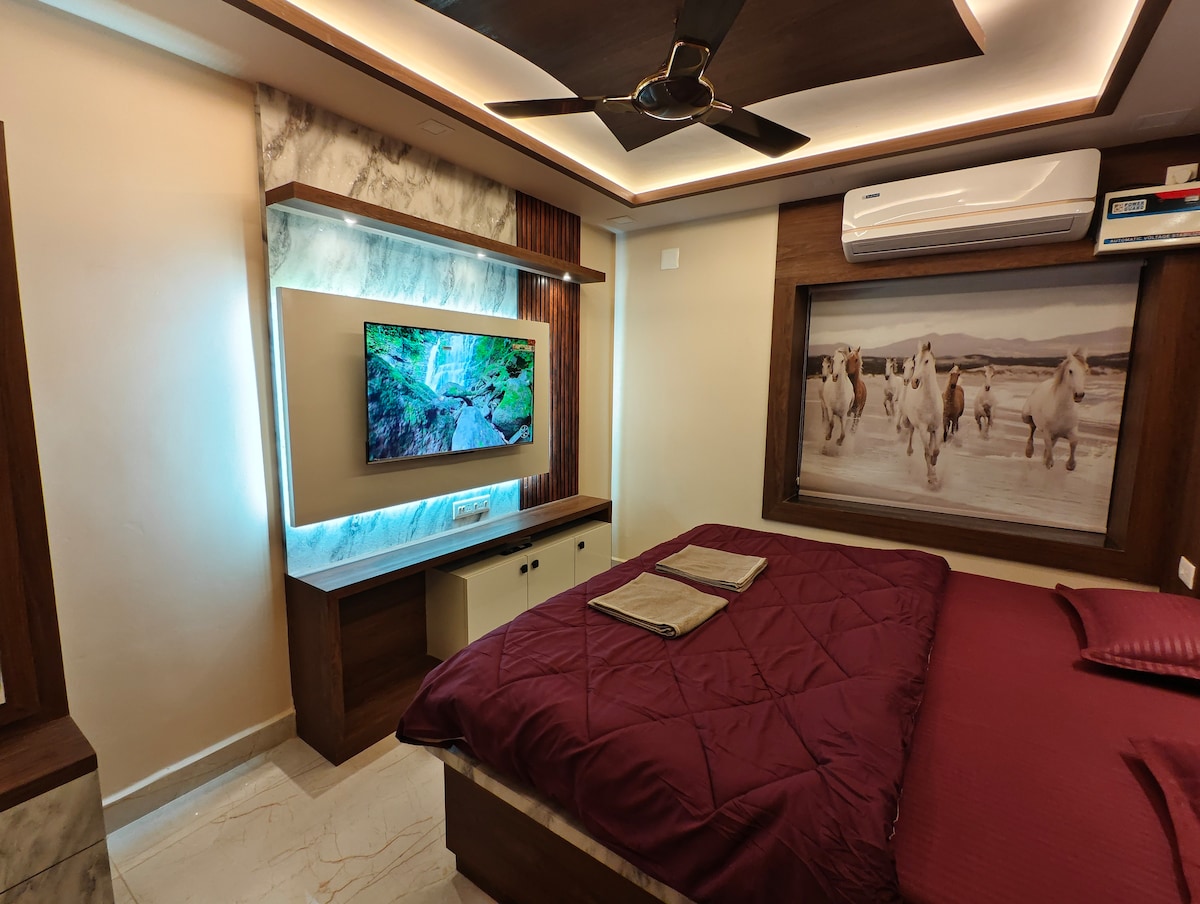 Bedroom with air conditioning and wall art