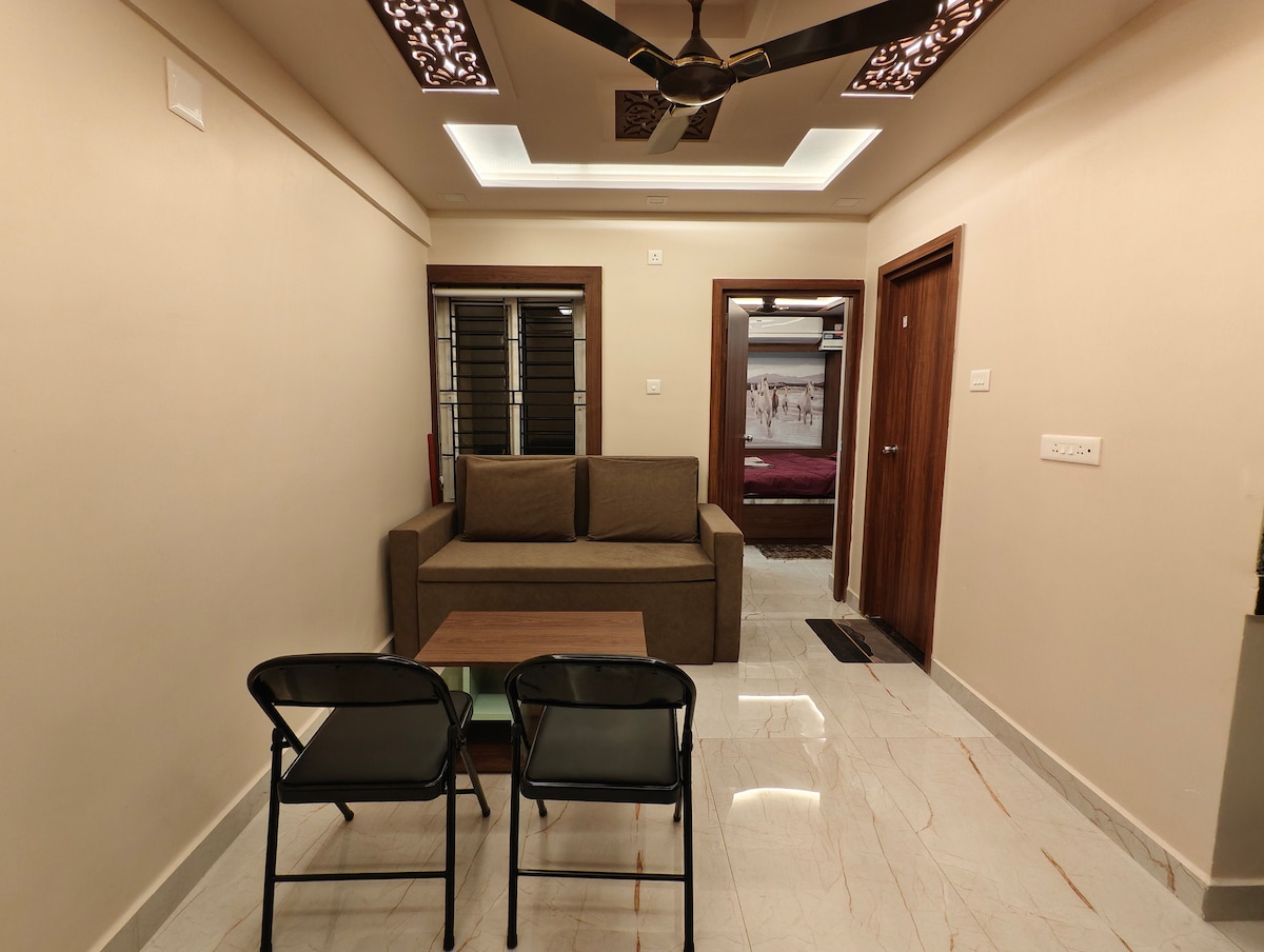 Living and dining area with sofa-cum-bed at The Riansh Homestay